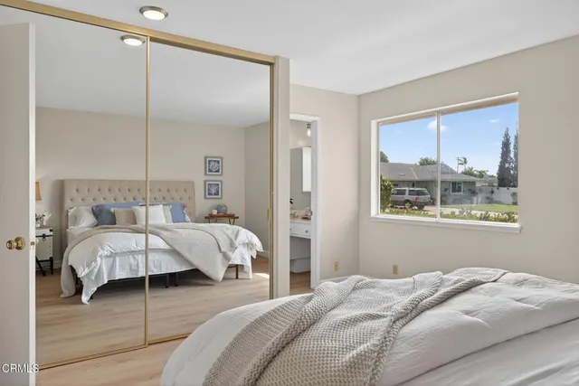 a bathroom with a toilet a sink a vanity and mirror