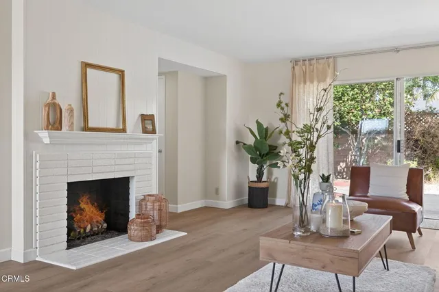 a living room with furniture and a lamp