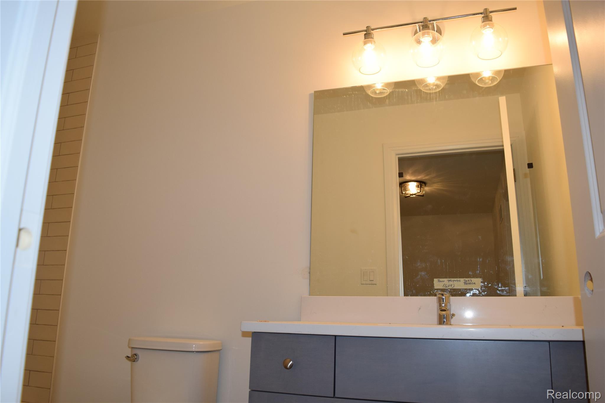 3093 Raffler Drive Rochester, MI 48307 - Photo 32 of 34 Bathroom featuring vanity and toilet