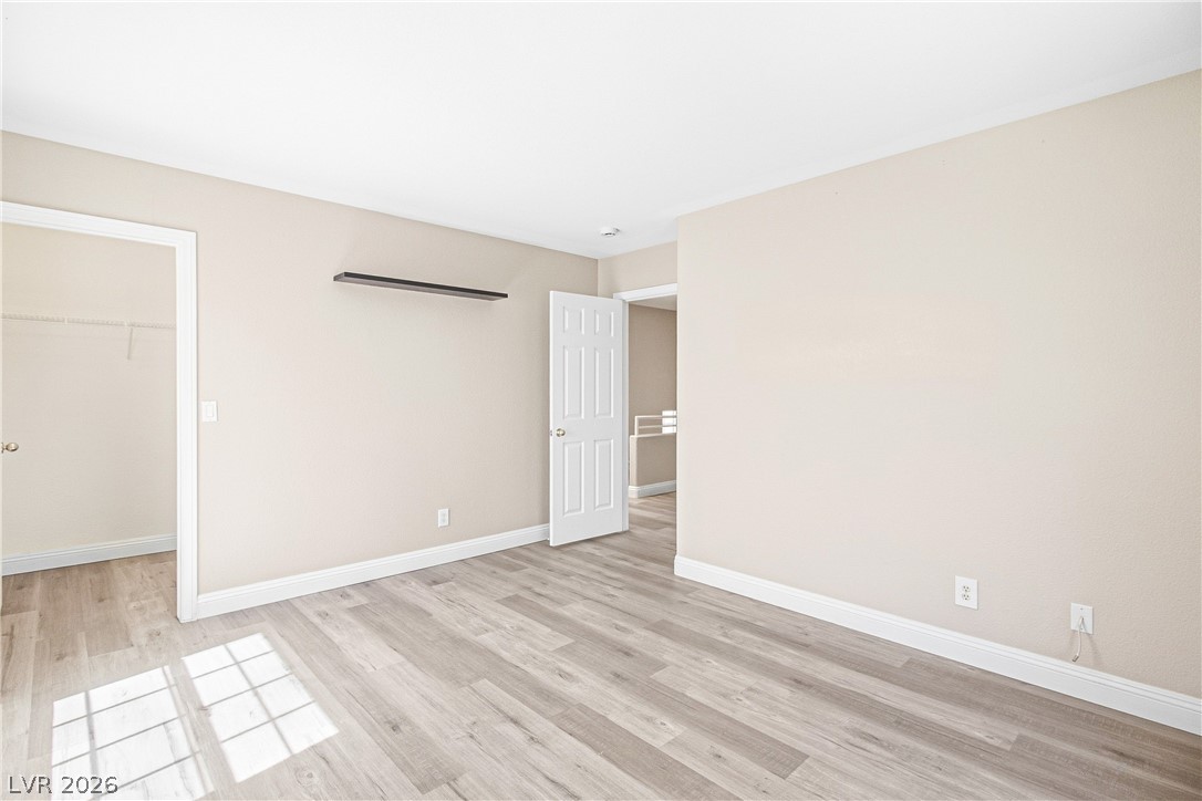 1475 Reef Ridge Court Las Vegas, NV 89128 - Photo 10 of 24 Gleaming wood-look floors and clean trim define this versatile auxiliary space.
