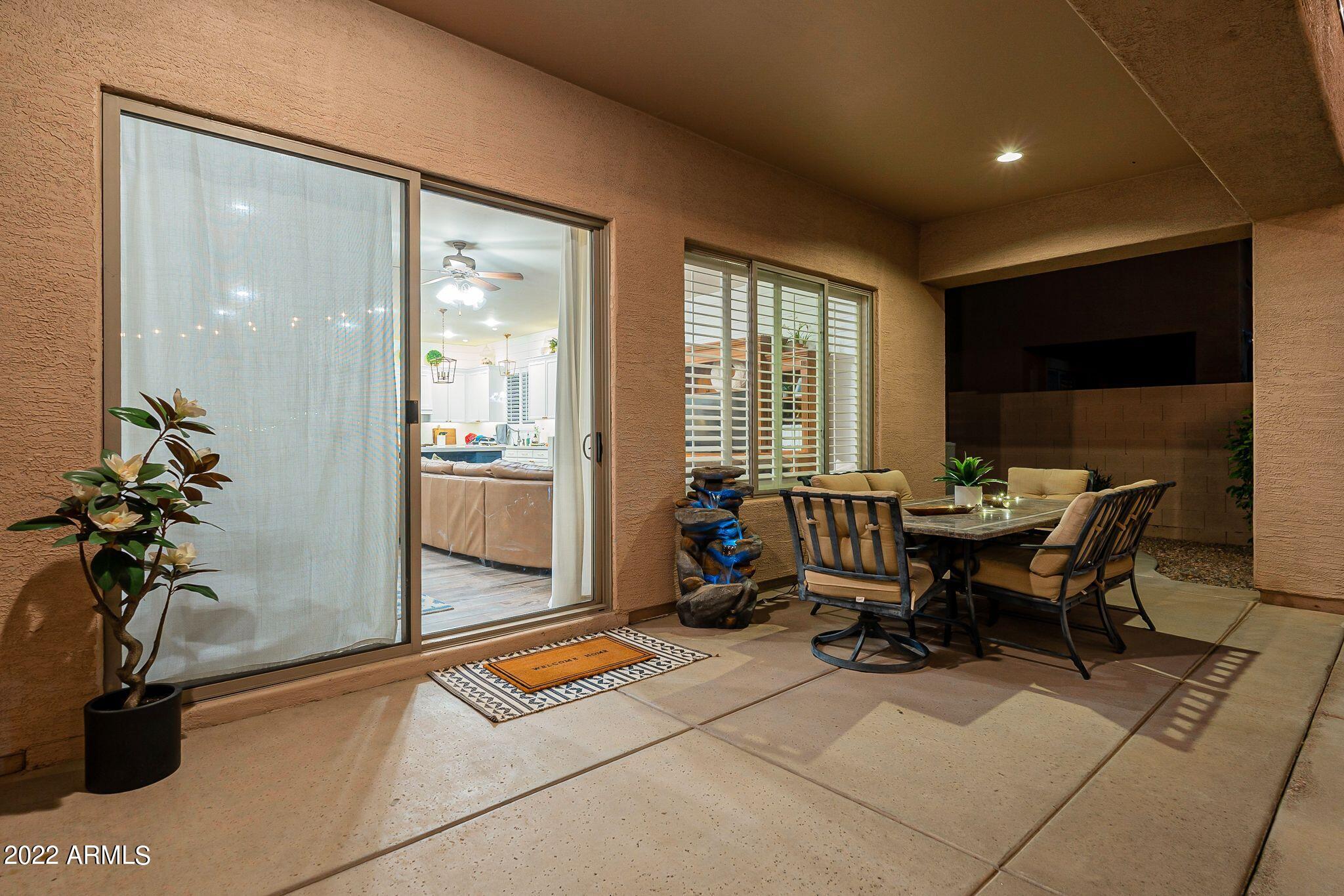 4770 East Buckboard Road Gilbert, AZ 85297 - Photo 72 of 97 a workspace with furniture and a potted plant