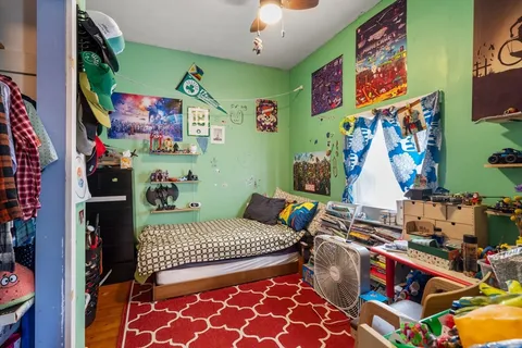 a bedroom with a bed and a couch