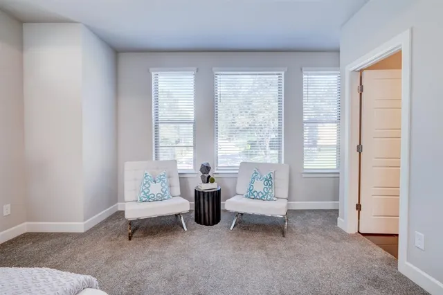 a spacious bathroom with a sink a mirror and a shower