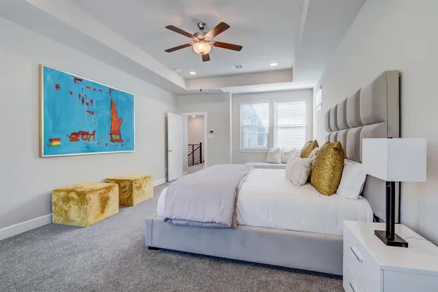 a bedroom with a bed and a cabinets