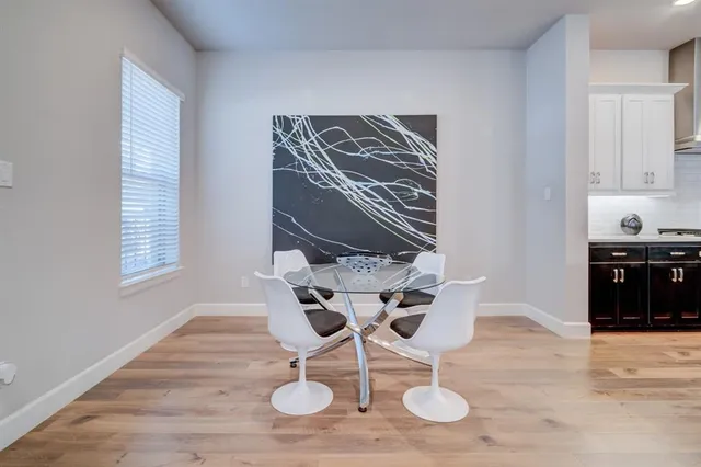 a view of dining room and wooden floor