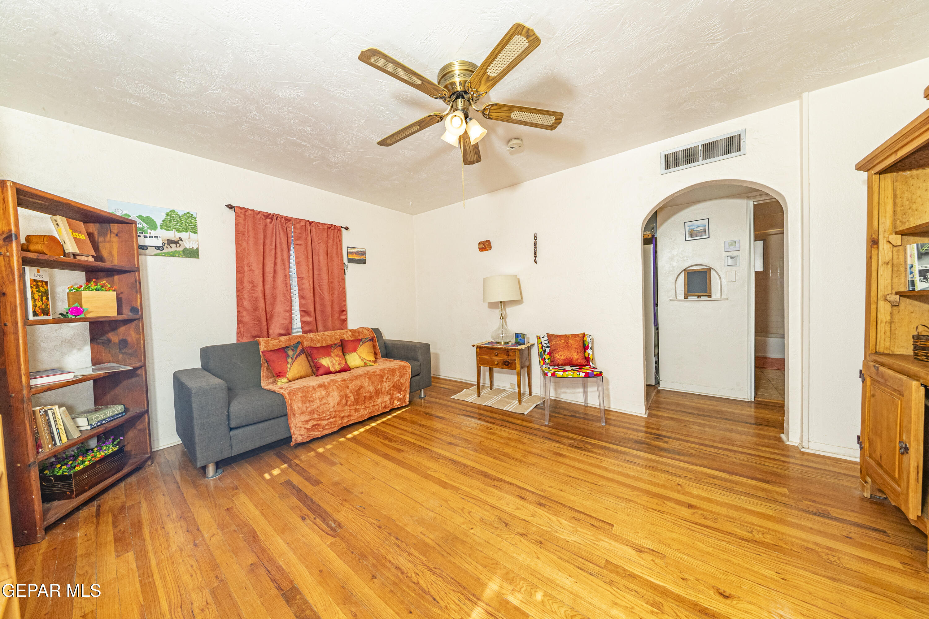 3329 Harrison Avenue El Paso, TX 79930 - Photo 11 of 38 a living room with furniture and a wooden floor