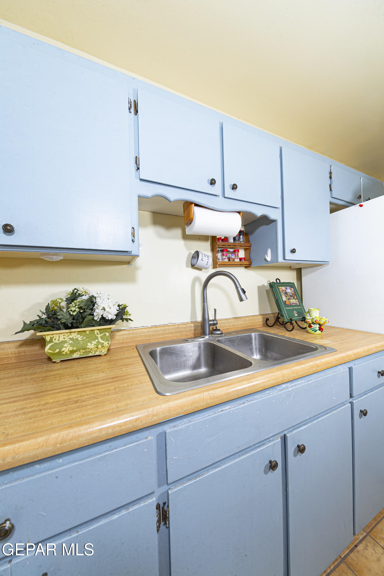 3329 Harrison Avenue El Paso, TX 79930 - Photo 12 of 38 a kitchen with a sink and cabinets