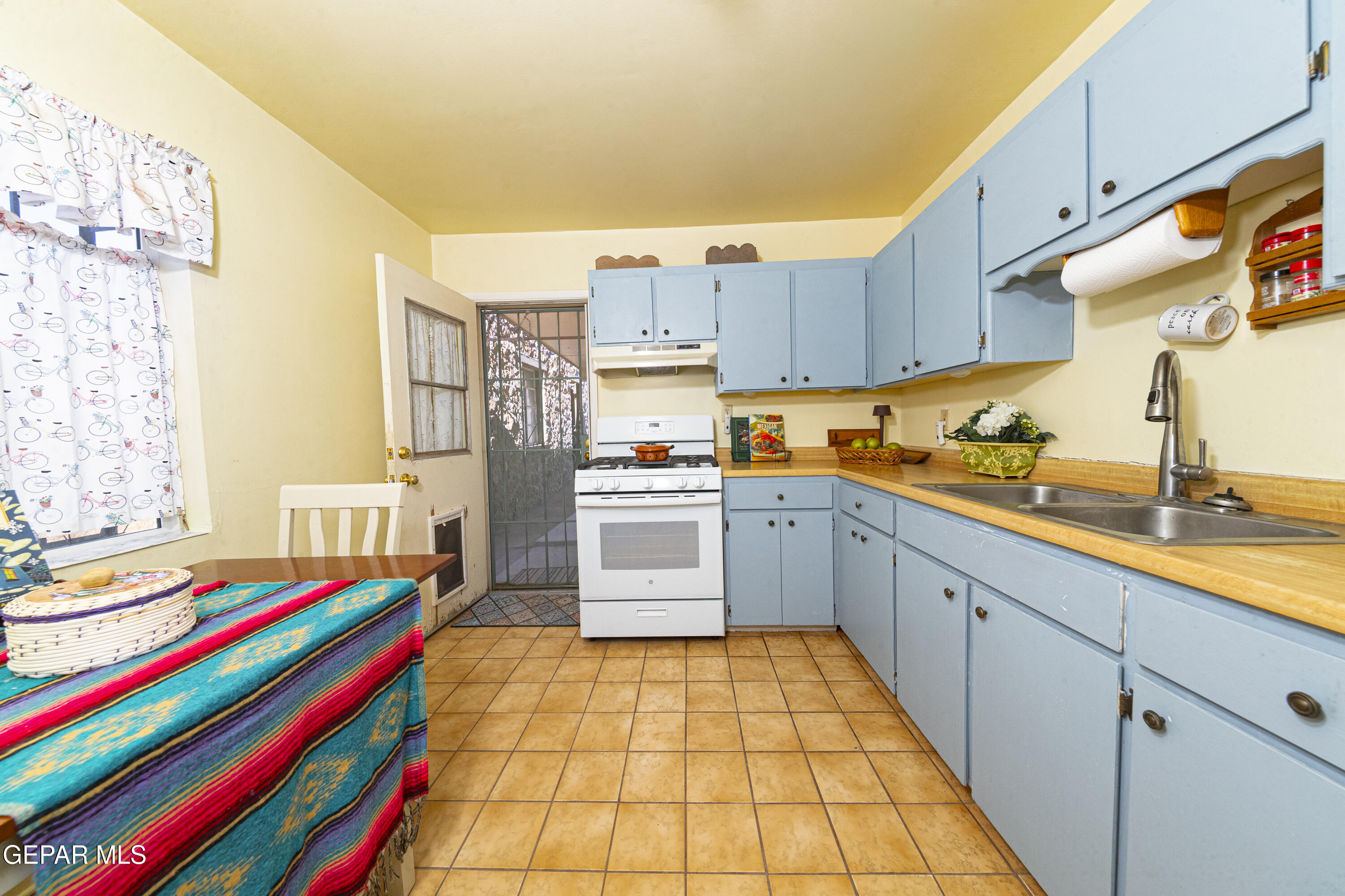 3329 Harrison Avenue El Paso, TX 79930 - Photo 15 of 38 a kitchen with stainless steel appliances and cabinets