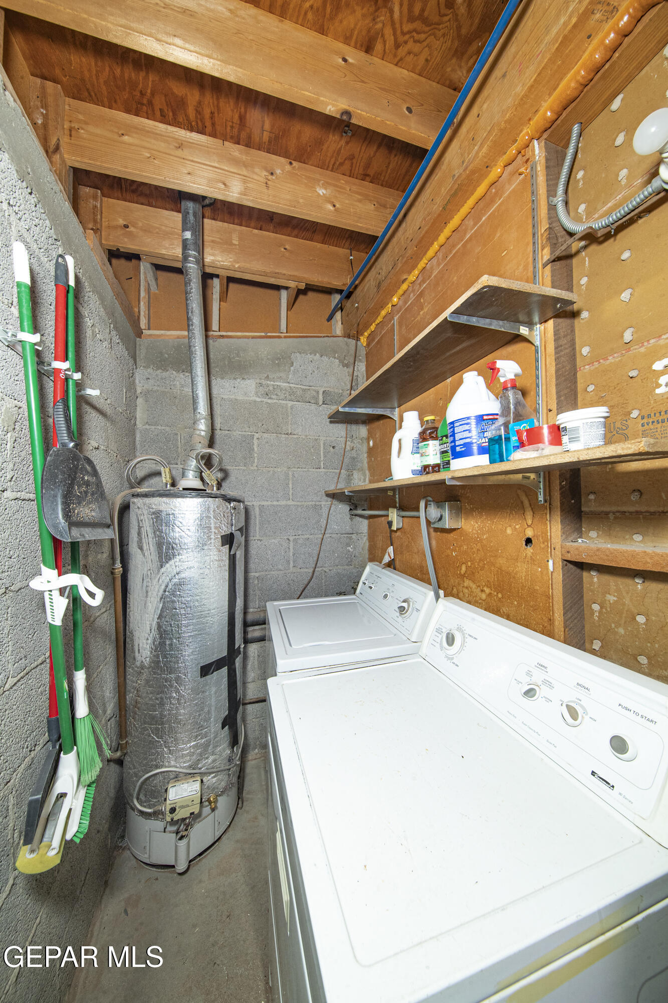 3329 Harrison Avenue El Paso, TX 79930 - Photo 25 of 38 a utility room with a refrigerator and washer