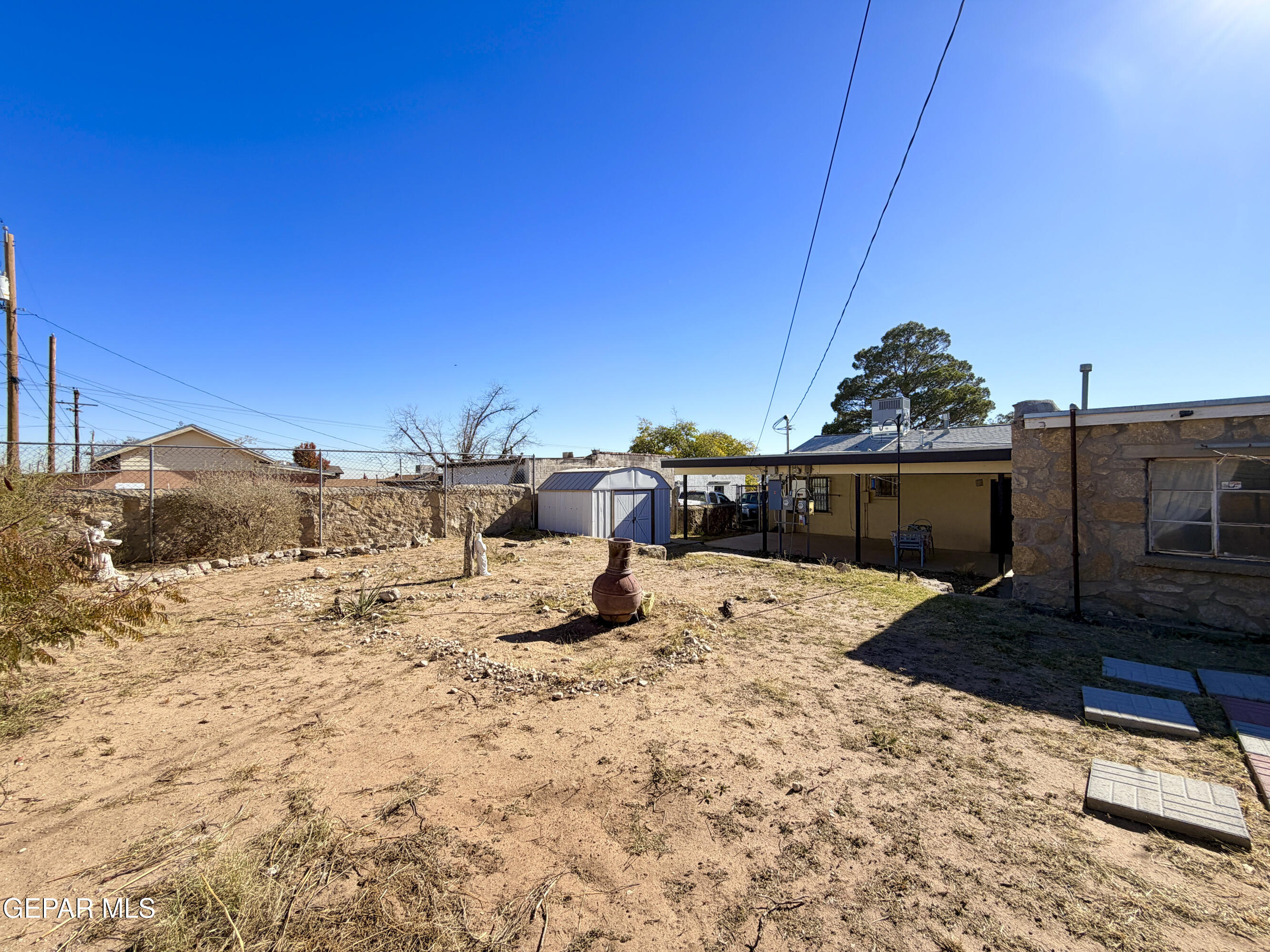 3329 Harrison Avenue El Paso, TX 79930 - Photo 28 of 38 a view of a dry yard with a barbeque