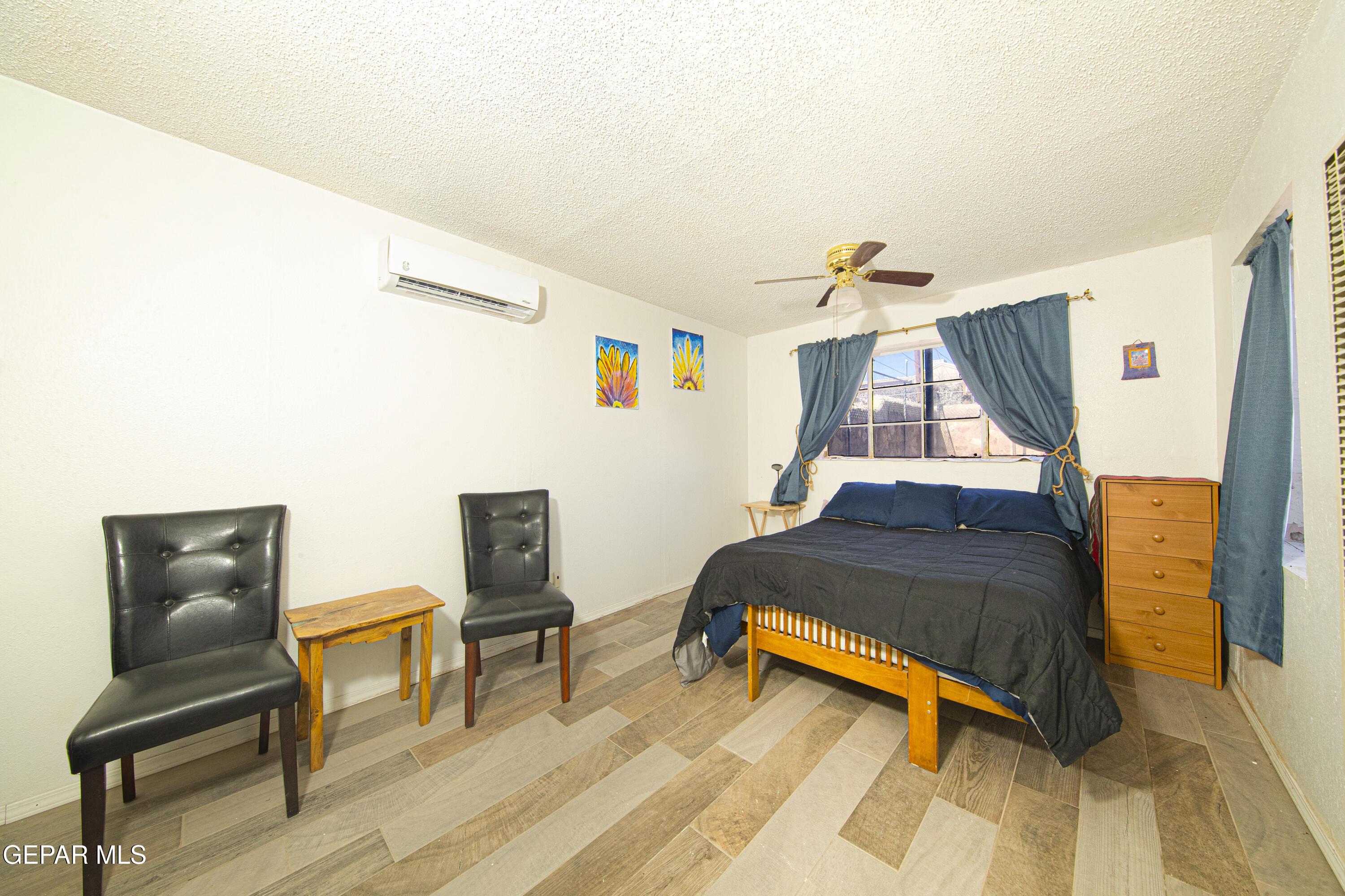 3329 Harrison Avenue El Paso, TX 79930 - Photo 31 of 38 a room with furniture and wooden floor