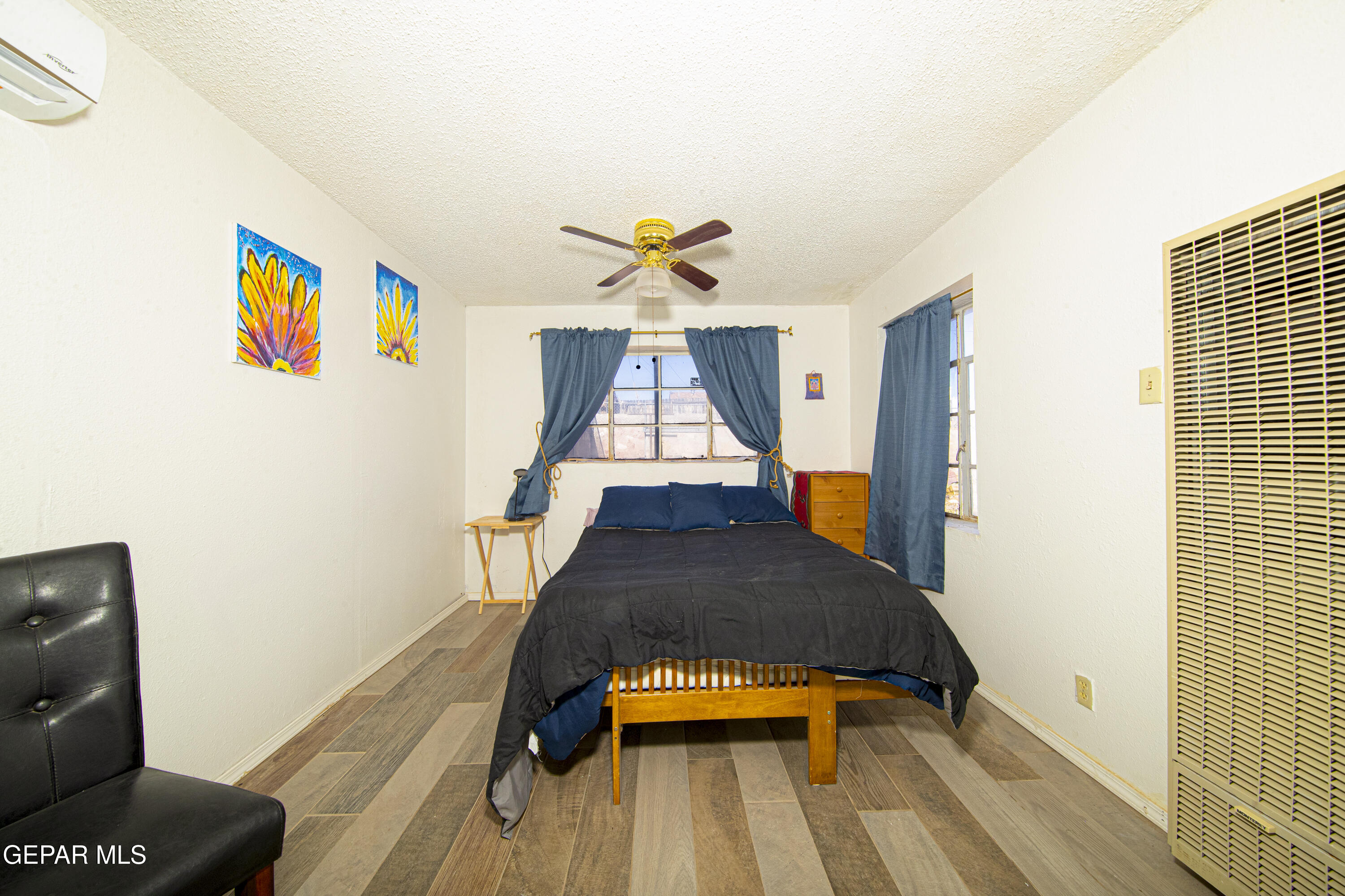 3329 Harrison Avenue El Paso, TX 79930 - Photo 32 of 38 a living room with furniture and wooden floor