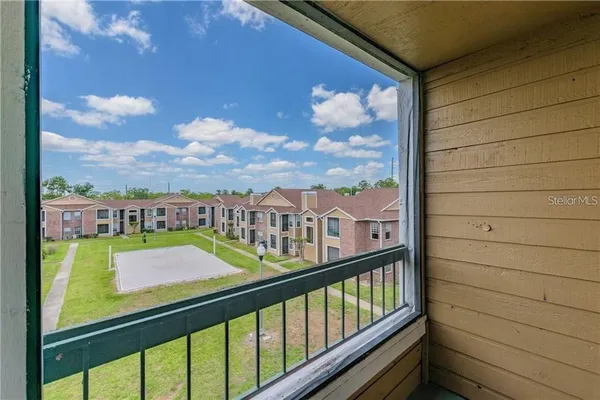 a view of a balcony with city view