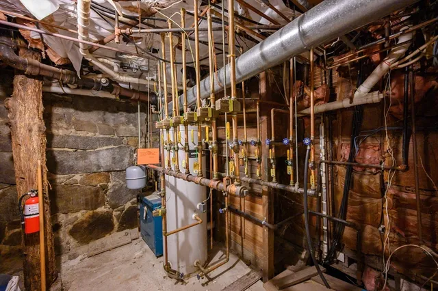 a kitchen with a sink appliances and cabinets