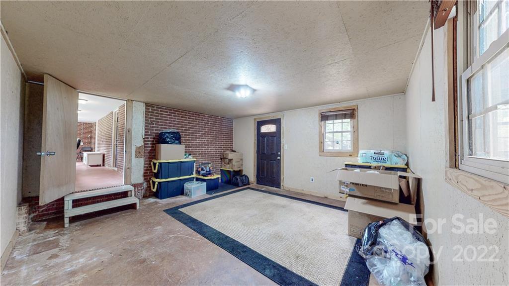 6118 South Rocky River Road Monroe, NC 28112 - Photo 20 of 33 a bedroom with furniture and window