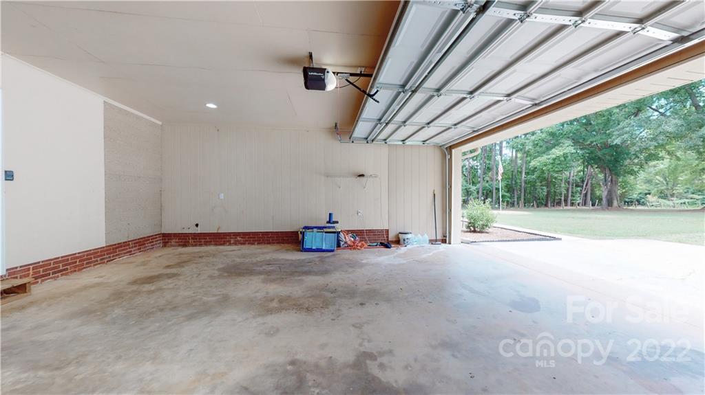 6118 South Rocky River Road Monroe, NC 28112 - Photo 21 of 33 a view of a livingroom with furniture and a fireplace