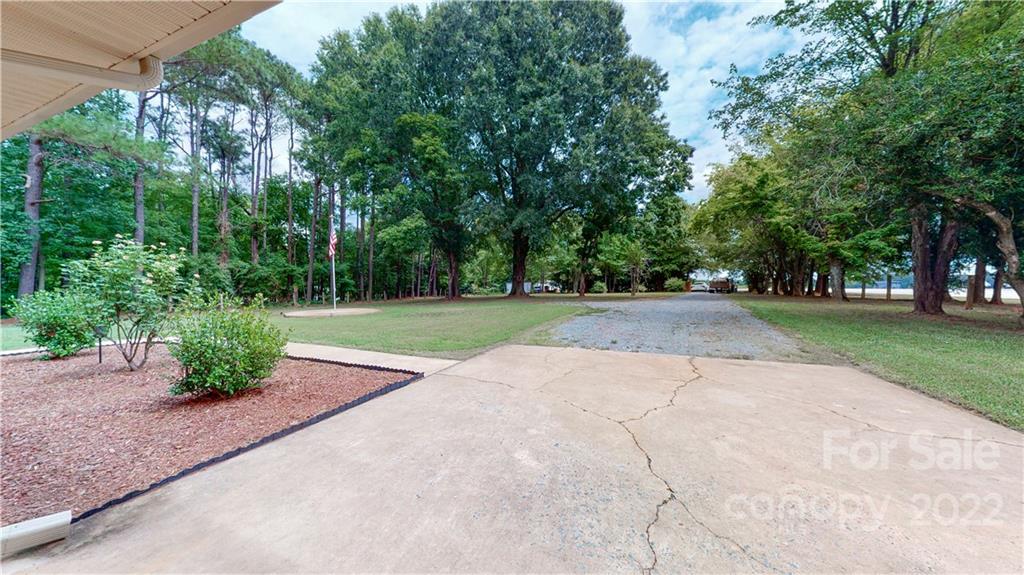 6118 South Rocky River Road Monroe, NC 28112 - Photo 22 of 33 a view of backyard with green space