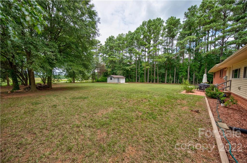 6118 South Rocky River Road Monroe, NC 28112 - Photo 24 of 33 a view of a tree in a yard