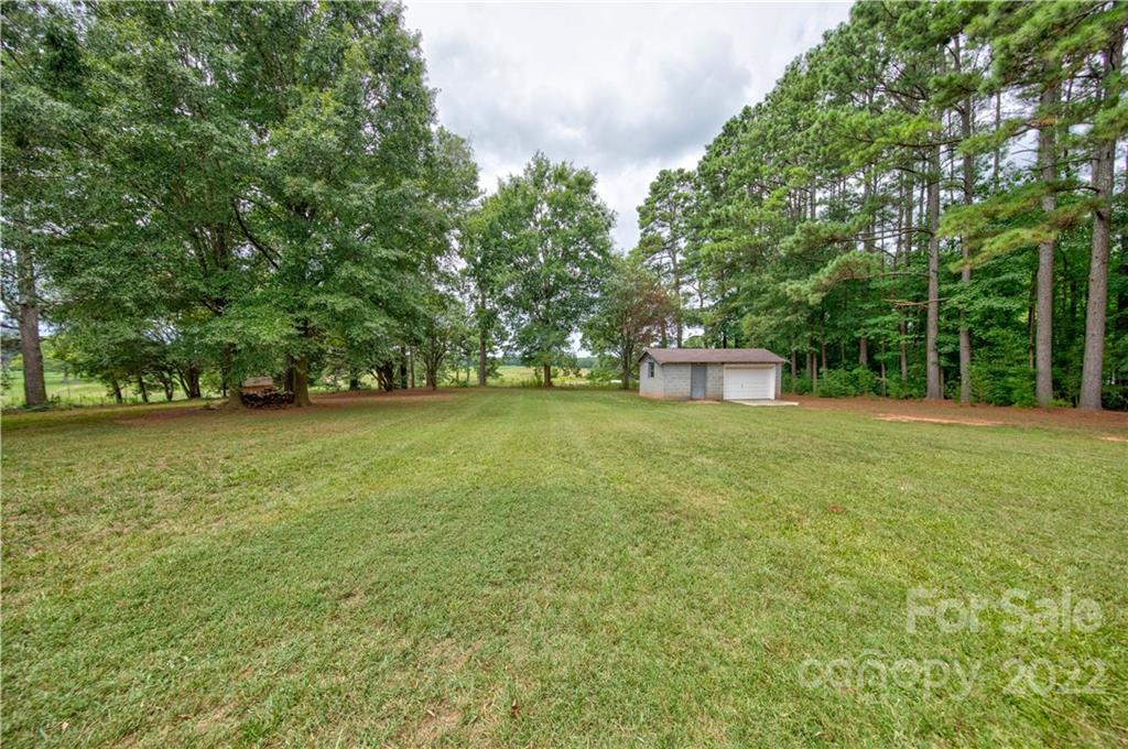 6118 South Rocky River Road Monroe, NC 28112 - Photo 25 of 33 a view of a green yard
