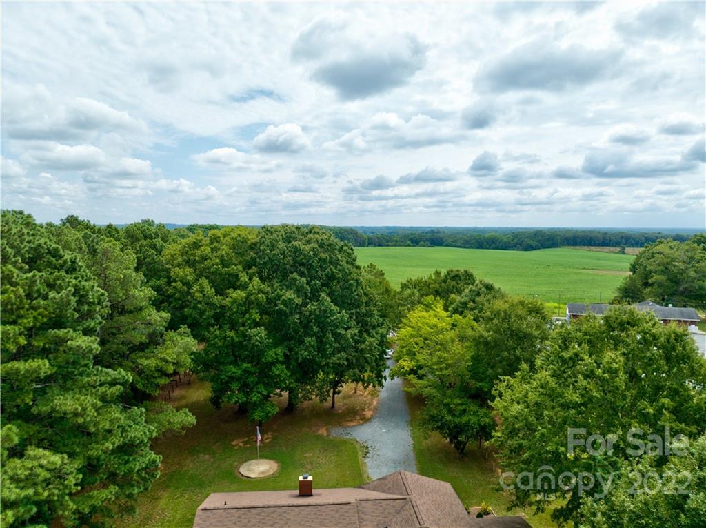 6118 South Rocky River Road Monroe, NC 28112 - Photo 5 of 33 a view of a lake with green space