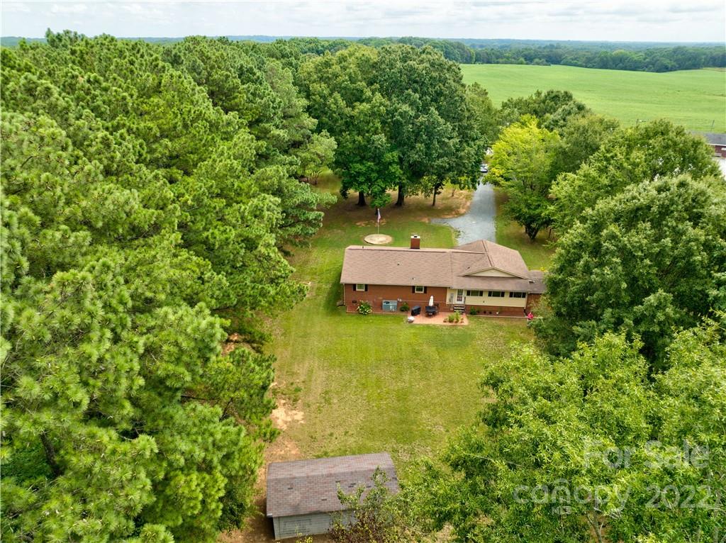 6118 South Rocky River Road Monroe, NC 28112 - Photo 6 of 33 a view of a house with a yard