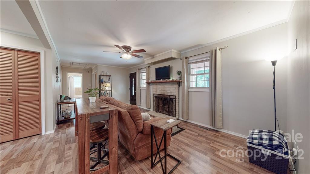 6118 South Rocky River Road Monroe, NC 28112 - Photo 8 of 33 a view of a dining room with furniture window and wooden floor