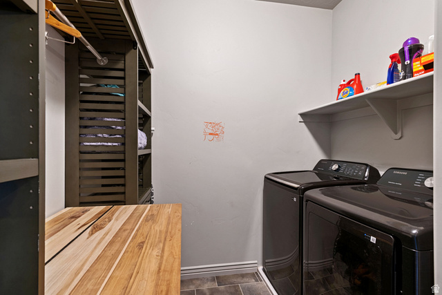 203 North 1900th Street West Mapleton, UT 84664 - Photo 30 of 48 Dedicated laundry area featuring a built-in shelving unit, a wood-finish folding surface, and wall-mounted storage shelves