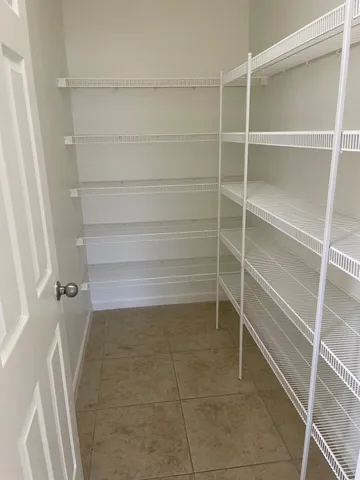a bathroom with a sink vanity and shower