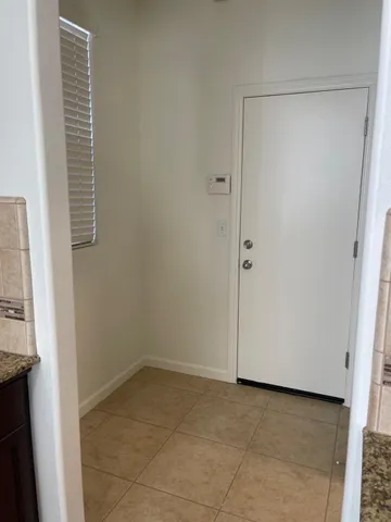 a kitchen with a sink and a mirror