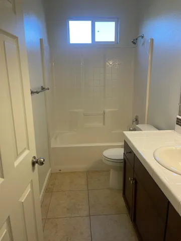 an empty room with a mirror