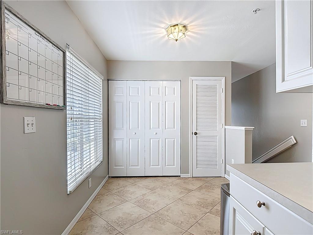 4970 Deerfield Way, Unit F203 Naples, FL 34110 - Photo 12 of 47 a view of an entryway with front door