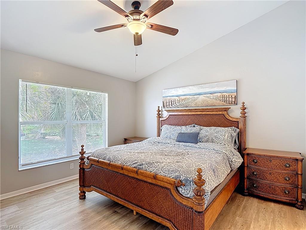 4970 Deerfield Way, Unit F203 Naples, FL 34110 - Photo 33 of 47 a bedroom with a large bed and a window