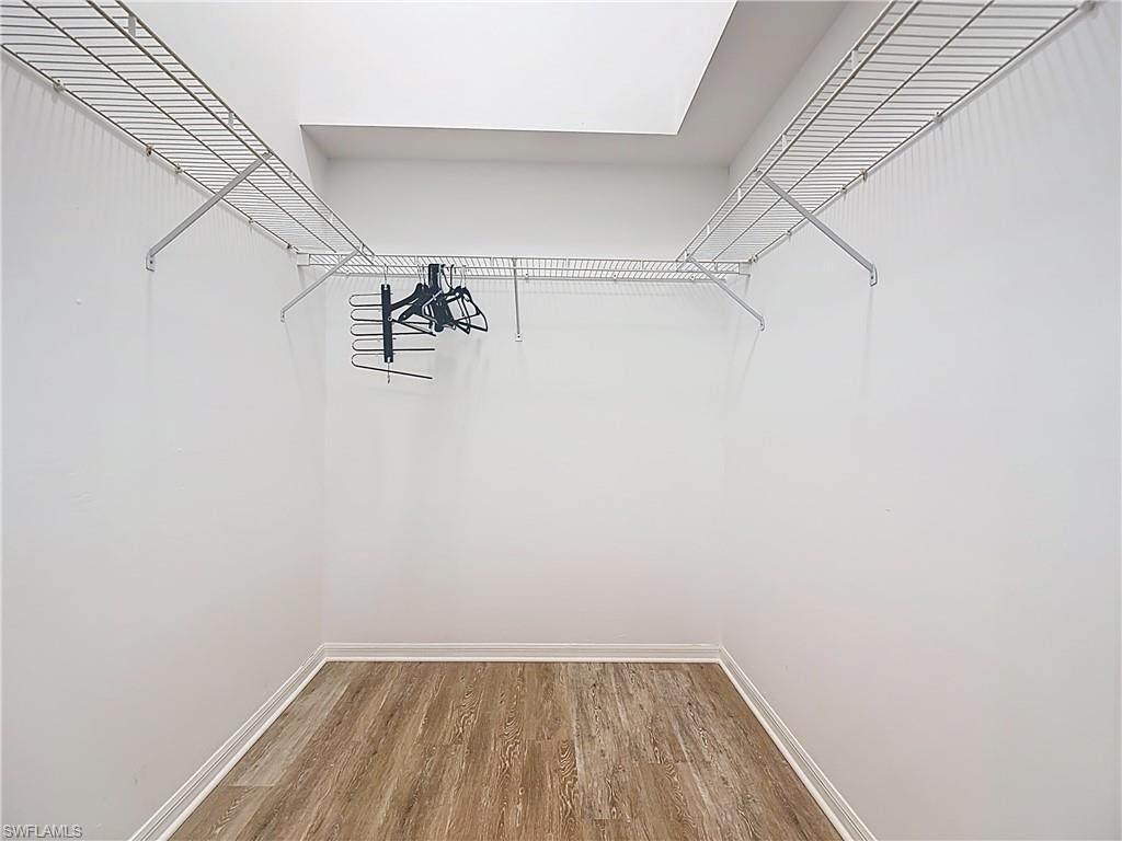 4970 Deerfield Way, Unit F203 Naples, FL 34110 - Photo 39 of 47 a view of a room with racks on the wall