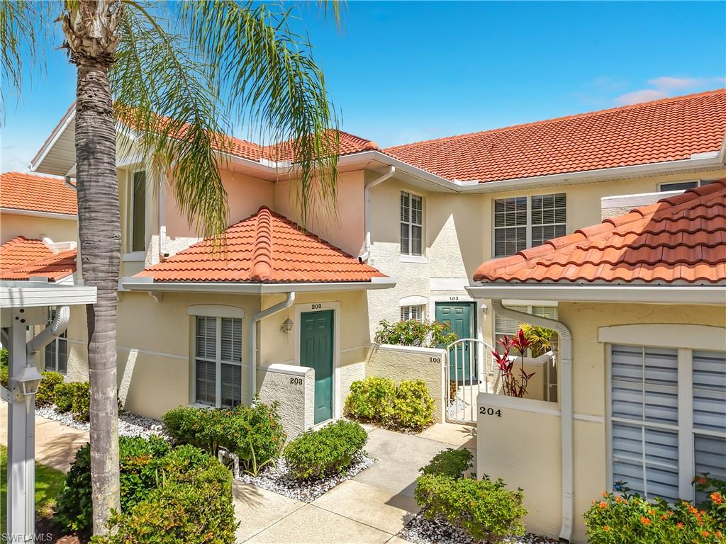 4970 Deerfield Way, Unit F203 Naples, FL 34110 - Photo 4 of 47 a front view of a house