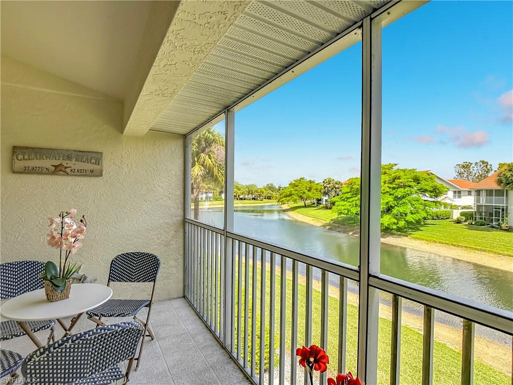 4970 Deerfield Way, Unit F203 Naples, FL 34110 - Photo 47 of 47 a view of a balcony with chairs