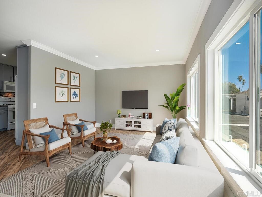1120 East Mission Road, Unit 81 Fallbrook, CA 92028 - Photo 1 of 1 a living room with furniture and a flat screen tv