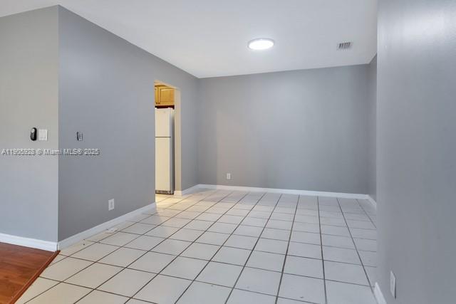 22765 Southwest 66th Avenue, Unit 205 Boca Raton, FL 33428 - Photo 11 of 24 a view of an empty room and window