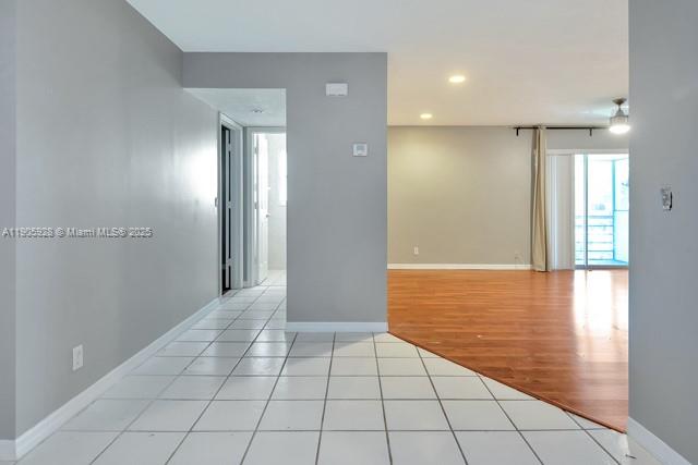 22765 Southwest 66th Avenue, Unit 205 Boca Raton, FL 33428 - Photo 14 of 24 a view of a livingroom with an empty space and a window