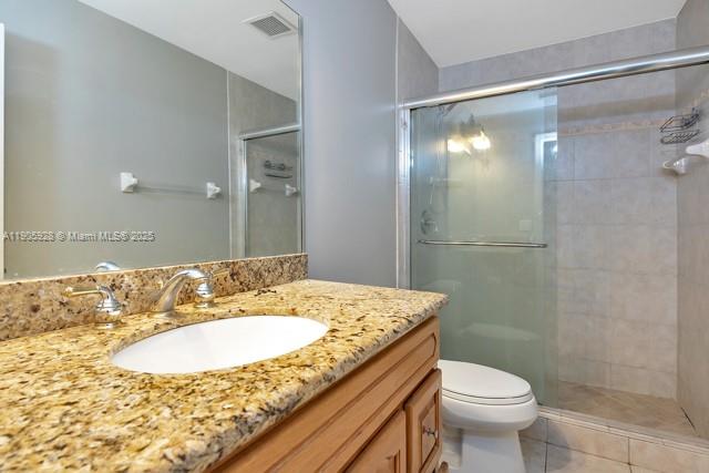 22765 Southwest 66th Avenue, Unit 205 Boca Raton, FL 33428 - Photo 22 of 24 a bathroom with a sink and a mirror