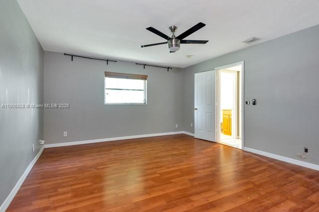 22765 Southwest 66th Avenue, Unit 205 Boca Raton, FL 33428 - Photo 23 of 24 a view of a big room with wooden floor and windows