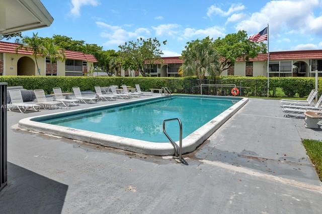 22765 Southwest 66th Avenue, Unit 205 Boca Raton, FL 33428 - Photo 24 of 24 a view of house with a yard and outdoor seating