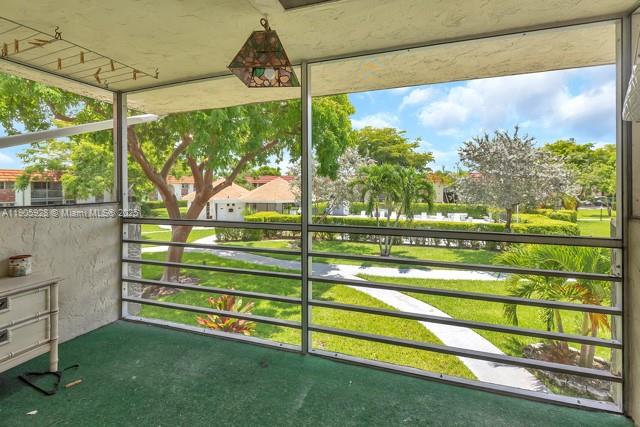 22765 Southwest 66th Avenue, Unit 205 Boca Raton, FL 33428 - Photo 9 of 24 a view of a two chairs in the garden