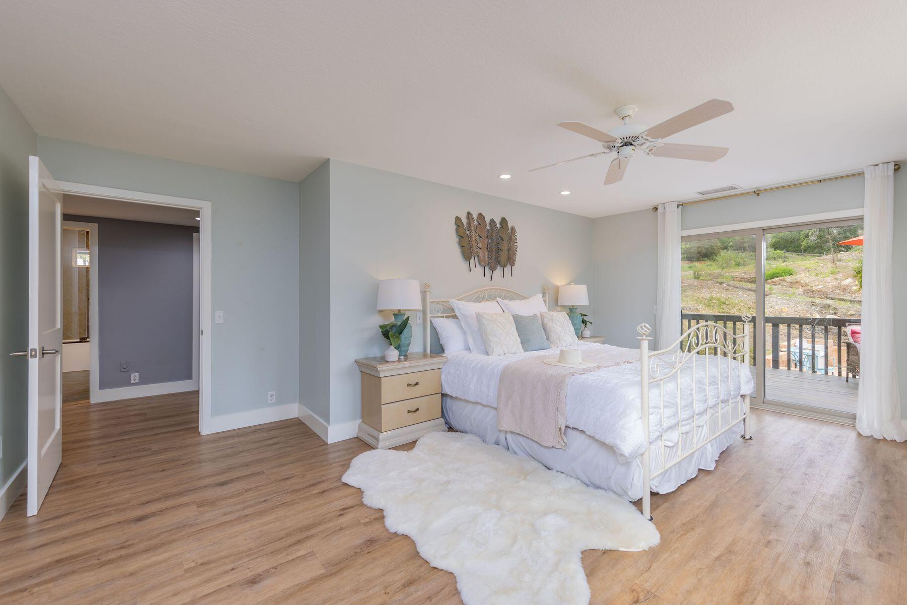 217 Sunset Street Oak View, CA 93022 - Photo 13 of 28 a spacious bedroom with a bed and a large window