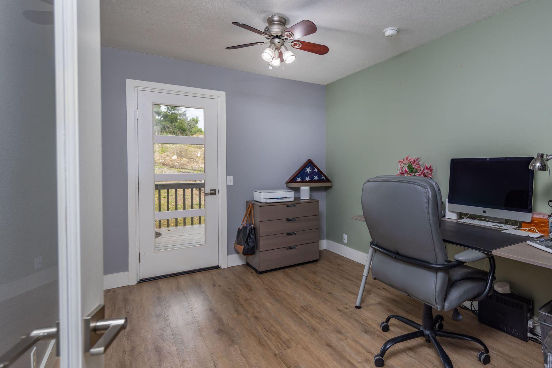 217 Sunset Street Oak View, CA 93022 - Photo 19 of 28 a workspace with furniture window and wooden floor
