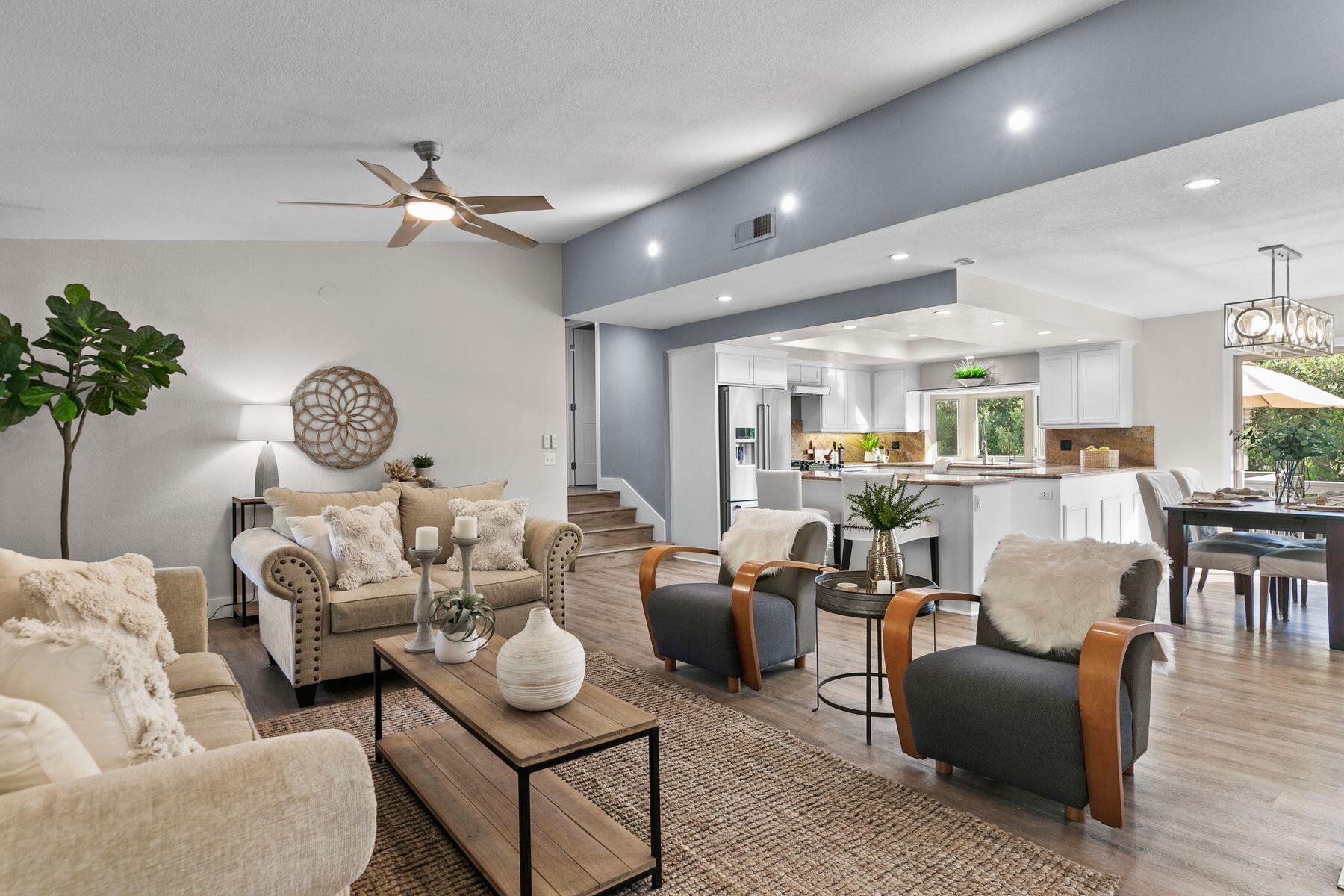 217 Sunset Street Oak View, CA 93022 - Photo 4 of 28 a living room with furniture a rug and a chandelier