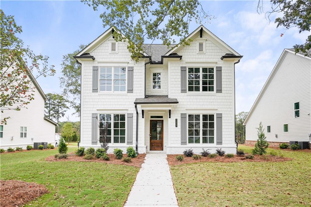 front view of a house with a yard