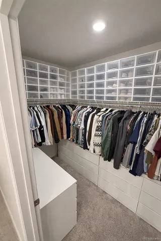 a spacious bathroom with a double vanity sink and mirror