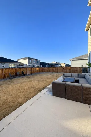 a view of a balcony with wooden floor