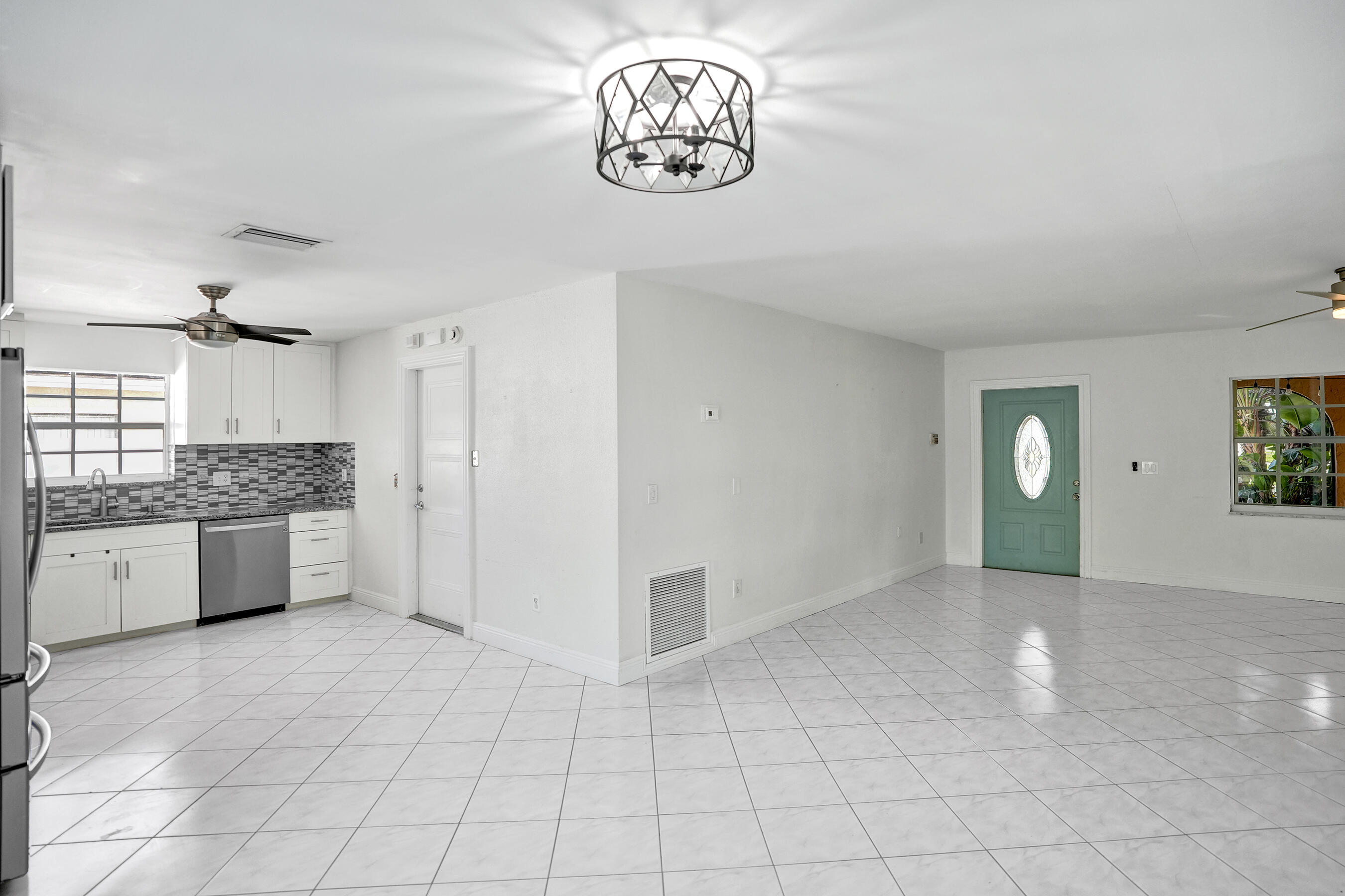 22335 Boulder Street Boca Raton, FL 33428 - Photo 12 of 36 a view of an empty room with a window