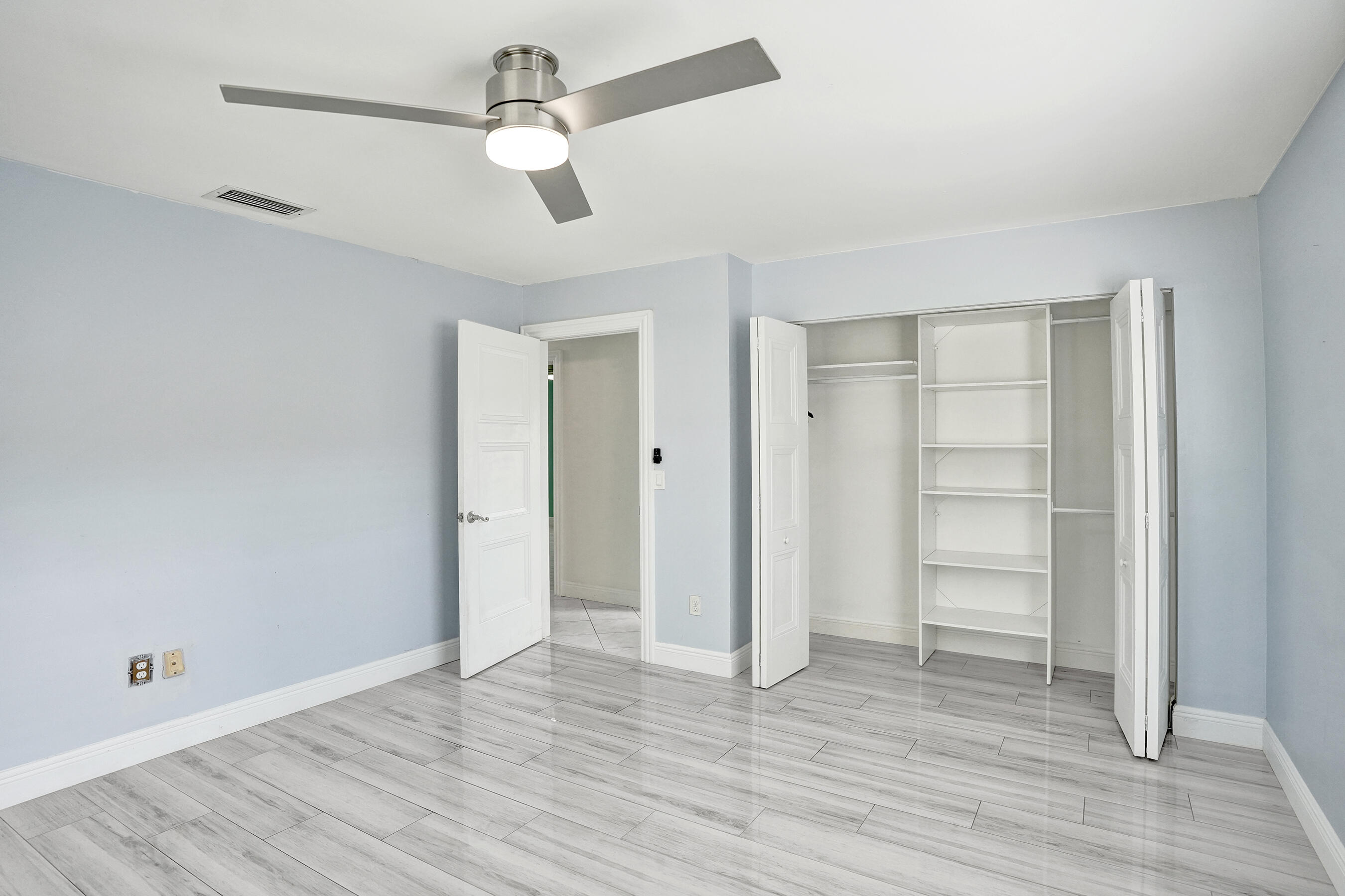 22335 Boulder Street Boca Raton, FL 33428 - Photo 17 of 36 wooden floor in an empty room with a window